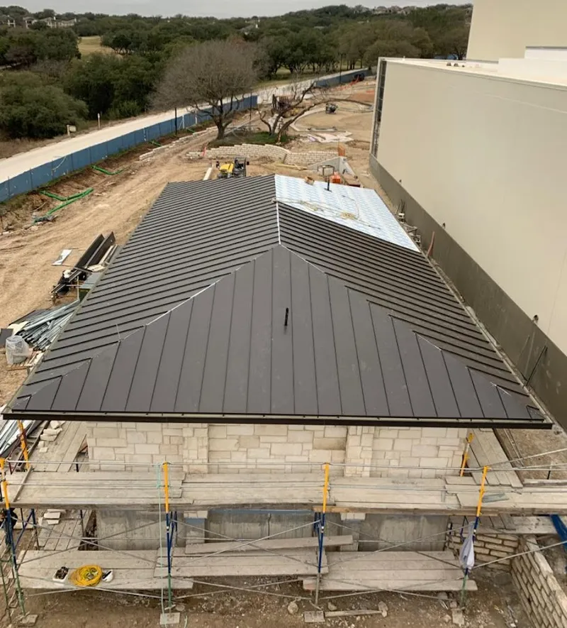 Metal roof new construction with scaffolding in Berkley